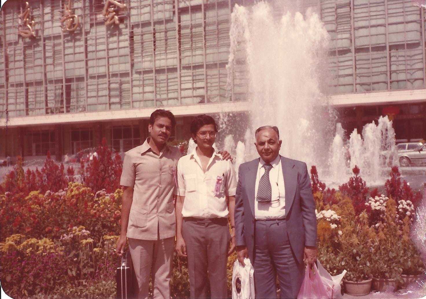 Vijay Dubey, Nilesh Dattani and Mr. Patak at the Canton Fair fountain, late 1980s