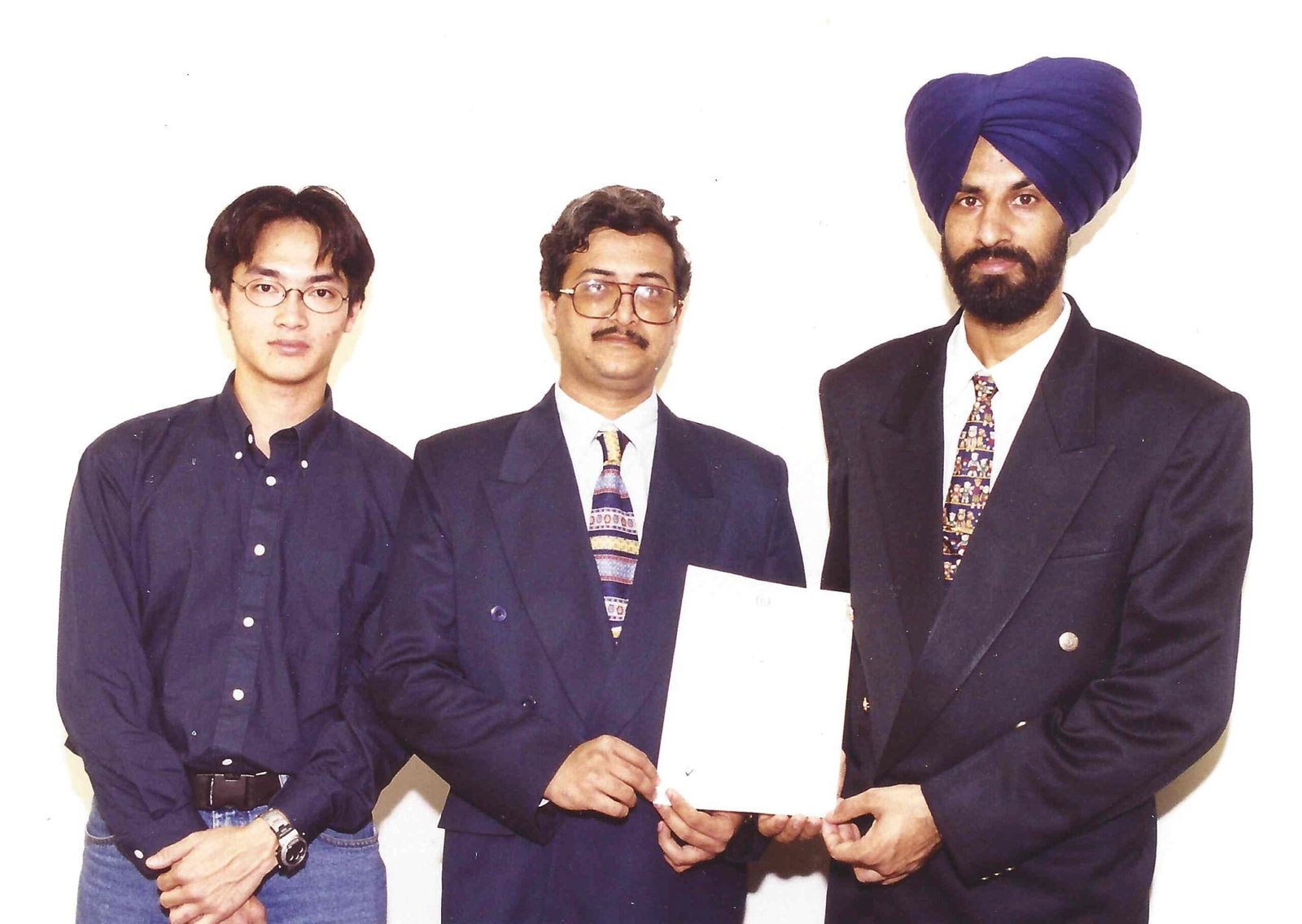 ISO 9001 achieved 1998 — Nilesh Dattani with Simon Tse and Kulwant Singh Uppal